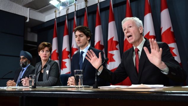 From right to left: Minister of Foreign Affairs Stephane Dion delivers a statement as he is joined by Prime Minister Justin Trudeau, Minister of International Development and La Francophonie Marie-Claude Bibeau and Minister of National Defence Harjit Sajjan during a press conference at the National Press Theatre in Ottawa on Monday, Feb. 8, 2016.. This week Dion re-iterated that the government would not use the term *at war* to describe actions agains Daesh (ISIS-ISIL)