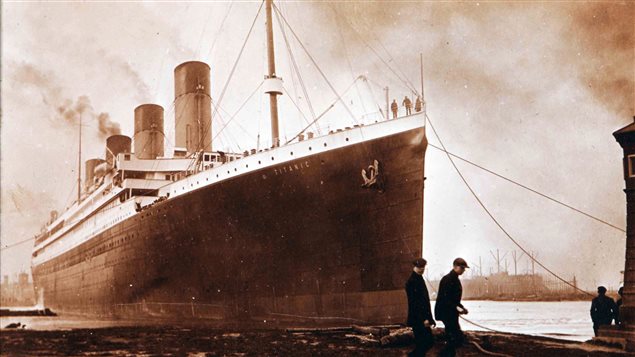 A photo from a Belfast family album shows the Titanic in port. It was the largest passenger ship of its time. 