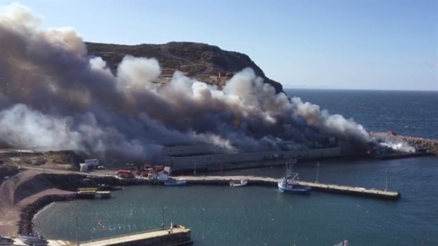 Whipped by fierce winds, fire tears through the Quinlan Brother fish and seafood processing plan in Bay de Verde, Newfoundland and Labrador.