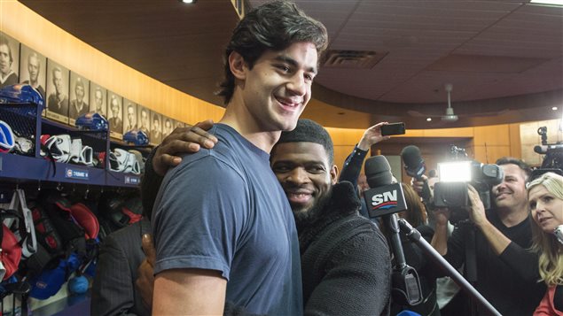 Montreal Canadiens hockey player P.K. Subban, right, hugs captain Max Pacioretty to prove that  all the players get along.