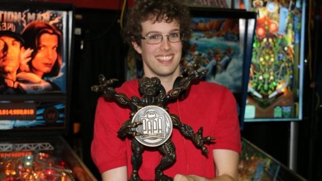 Robert Gagno holds up his trophy of a martian from the PAPA world championships.