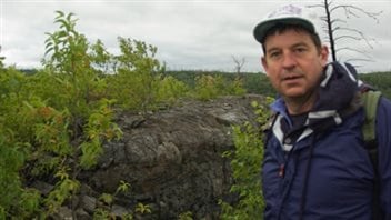 Sampling the 1.9 billion year old Gunflint Iron Formation in northern Minnesota. He is a professor of geomicrobiology in the Department of Earth and Atmospheric Sciences at the University of Alberta.