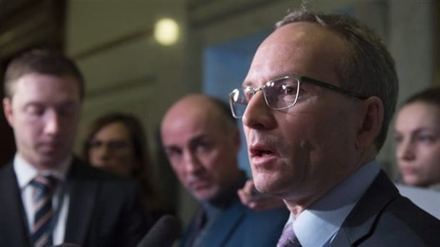 The Quebec Premier, Philippe Couillard says he will whip the vote on Bill 64. Public Security Minister Martin Coiteux (shown here) has labelled gun owners opposed to the bill as *anarchistes*.