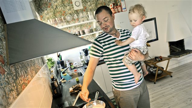 This June 29, 2011 photo shows a Swedish father who was allowed to split parental leave with his child’s mother, but for much longer than Canadian fathers are currently allowed.