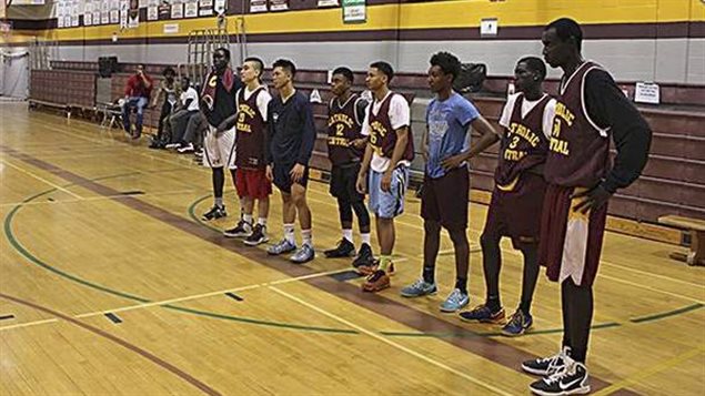 Nicola at over 2 metres (R), towers above the other high school players