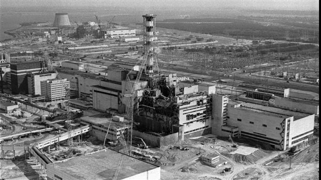  A 1986 file photo of an aerial view of the Chernobyl nuclear plant in Chernobyl, Ukraine showing damage from an explosion and fire in reactor four on April 26, 1986 that sent large amounts of radioactive material into the atmosphere.