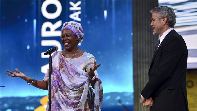  US Actor George Clooney, right, listens to Marguerite Barankitse, after presenting her the first Aurora Prize, an award recognizing an individual’s work to advance humanitarian causes during an awarding ceremony in Yerevan, Armenia, Sunday, April 24, 2016. Barankitse saved thousands of lives and cared for orphans and refugees amid the Burundi civil war. Armenian philanthropists selected her for the award.