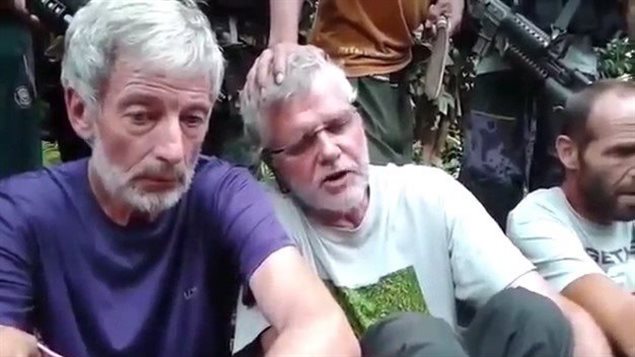  Robert Hall, left, and John Ridsdel are seen in this still image taken from an undated militant video. Canadians Hall and Ridsdel, a Norwegian man and a Filipina woman were taken hostage by gunmen from the Holiday Ocean View Samal Resort on Samal Island in the Philippines in September. THE CANADIAN PRESS/HO via Youtube