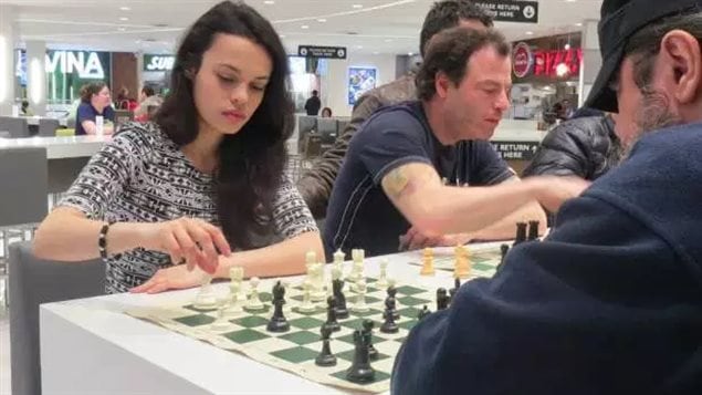 Ashley Tapp, left, 16, plays chess at the Park Royal mall, West Vancouver in this March 2016 