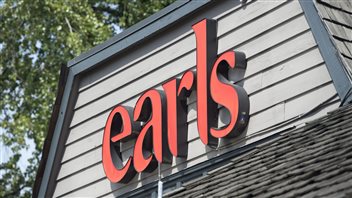 It remains to be seen how dropping of Alberta beef will affect sales at the Earls restaurants, like this one in in North Vancouver. We look up at toward a slatted, boarded rectangular structure sitting atop a singled roof. The word 