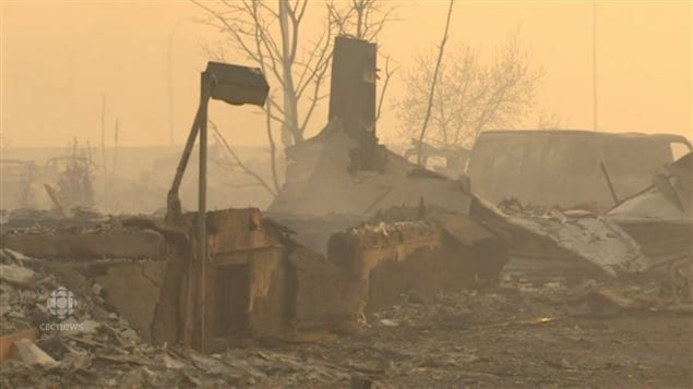 Photos above and below show burned out neighbourhoods in Ft McMurray.