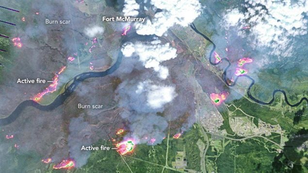  On May 4, 2016, the the Enhanced Thematic Mapper Plus (ETM+) on the Landsat 7 satellite acquired this false-color image of the wildfire that burned through Fort McMurray in Alberta, Canada. The image combines shortwave infrared, near infrared, and green light (bands 5-4-2). Near- and short-wave infrared help penetrate clouds and smoke to reveal the hot spots associated with active fires, which appear red. Smoke appears white and burned areas appear brown. 