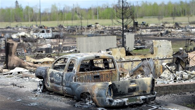  A burned out truck is shown in the Beacon Hill neighbourhood during a media tour of the fire-damaged city of Fort McMurray, Alta. on Monday, May 9, 2016. 
