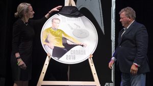 Royal Canadian Mint CEO Sandra Hanington and actor William Shatner unveil the first coin in a new collection celebrating the 50th anniversary of Star Trek: The Original Series at the Canada Aviation and Space Museum in Ottawa, Ontario on May 12, 2016
