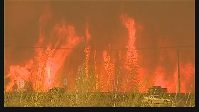 Vehicles trying to escape the massive wall of flames at Fort McMurray in Alberta. The inferno is just one of many fires now burning across Canada. Wildfire expert Mike Flannigan says scientists in that field and others say AGW means more and bigger fires in future.