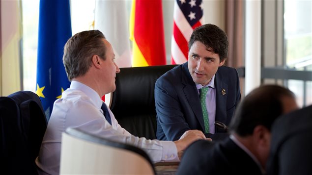  British Prime Minister David Cameron, left, and Canadian Prime Minister Justin Trudeau, talk as they prepare to participate in a G-7 Working Session in Shima, Japan, Friday, May 27, 2016, during the G-7 Summit.