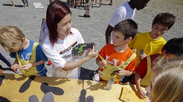 Students in Vancouver “work” in a simulated sweatshop run by World Vision last June to raise awareness about child labour around the world.