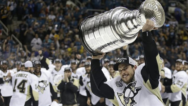 Canadian Sidney Crosby raised the Stanley Cup after his team, the Pittsburgh Penguins won it Sunday, June 12, 2016.