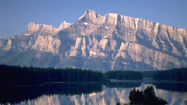  A view of Two Jack Lake in Banff National Park. More Canadians are expected to leave their passports at home this summer and hit the road in Canada as the weak loonie and low gas prices prompt a deeper exploration of their own country.