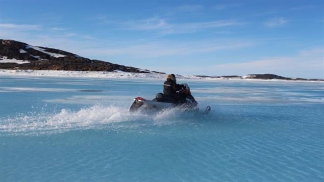 Meltwater is now accumulating on Frobisher Bay. The unpredictable ice conditions got the better of two hunters when their snowmobile and qamutik broke through the ice and sank. 