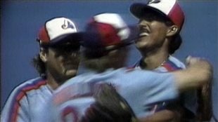 Martinez celebrates his crowning achievement with team-mates following his perfect game at Dodger Stadium on July 28, 1991. Martinez on the right of the picture has his head back in ecstasy as two team-mates embrace him. They are wearing the dark blue of the original Expos uniforms.