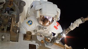  The Canadian Space Agency (CSA) Astronaut Dave Williams performs a spacewalk during Shuttle Mission STS-118 on August 11, 2007.