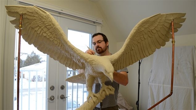 Tyler Fauvelle, Canadian artist, sculpts the eagle figure that became part of the bronze Sergeant Francis Pegahmagabow statue, unveiled in Parry Sound, Ontario on June 21, 2016. The three-metre bronze statue honours Canada’s most decorated Aboriginal war hero.