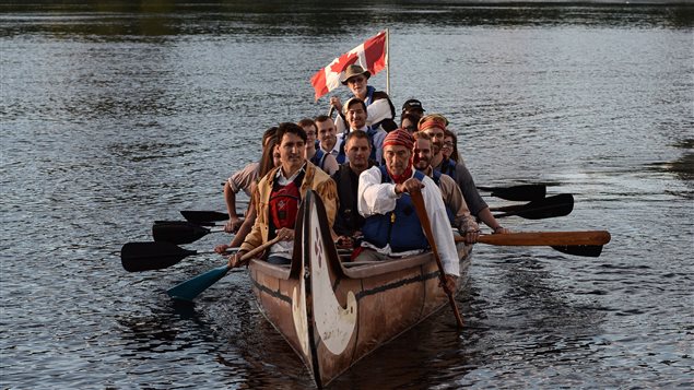 Prime Minister Justin Trudeau paddles in a traditional canoe on the Ottawa River following the National Aboriginal Day Sunrise Ceremony.