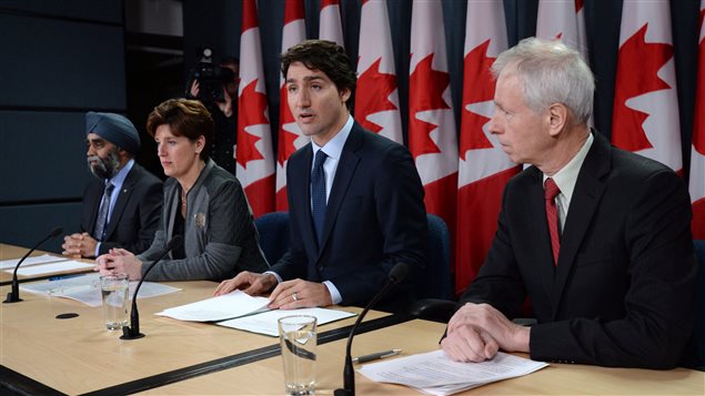  Defence Minister Harjit Sajjan, left to right, International Development Minister Marie-Claude Bibeau, Prime Minister Justin Trudeau and Foreign Affairs Minister Stephane Dion attend a news conference in Ottawa on Monday, Feb. 8, 2016. 