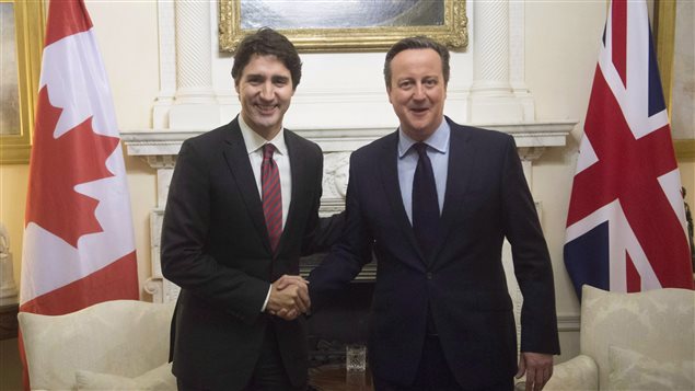  Canadian Prime Minister Justin Trudeau is greeted by United Kingdom Prime Minister David Cameron at 10 Downing St. Wednesday Nov.25, 2015 in London, England. 