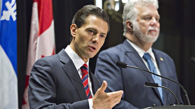 Mexico’s president Enrique Pena Nieto speaks at a joint press conference with Quebec Premier Philippe Couillard in Quebec City.