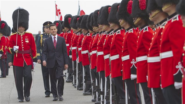  Mexico’s president Enrique Pena Nieto inspects during military ceremony in Quebec City Monday, June 27, 2016.