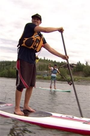 The owner of Stand Up Paddleboard Yukon Stuart Knaack demonstrates his technique. This is the first time paddleboards will be included in the race.