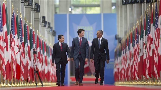  President Barack Obama walks with Canadian Prime Minister Justin Trudeau and Mexican President Enrique Pena Nieto at the National Gallery of Canada in Ottawa, Canada, Wednesday, June 29, 2016. 