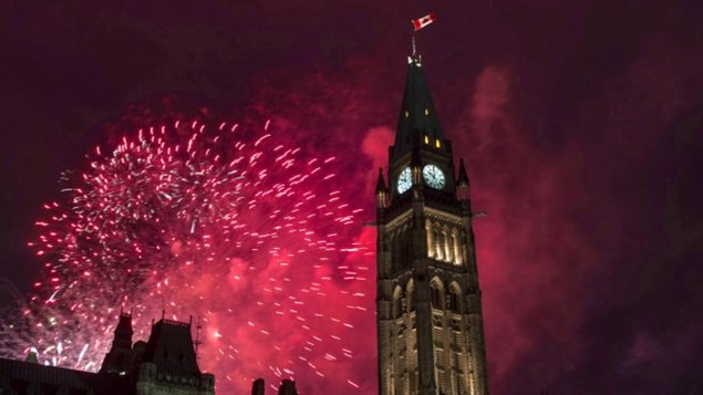 Fireworks explode behind the Peace Tower on Parliament Hill during Canada Day celebrations in Ottawa on July 1, 2015. 