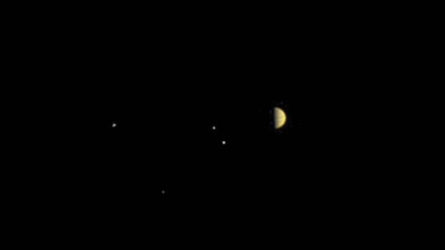 This photo, captured by NASA’s Juno spacecraft, shows Jupiter and four of its moons from a distance of 10.9 million kilometres. 