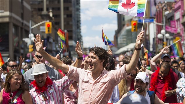 Prime Minister Justin Trudeau takes part in the annual Pride Parade in Toronto on Sunday, July 3, 2016. Pride Montreal said it tripled its security budget to deal with high-profile attendees, and to address fears in light of several high-profile car-ramming attacks.