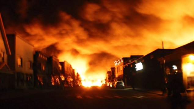 The inferno from burning tanker cars lights up the night sky on July 6, 2013 in the town of Lac Megantic. The fire killed 47 people several of whom were enjoying the summer evening on the terrace of a downtown bar when the train derailed and exploded.