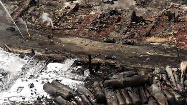 The aftermath showing the tank cars piled against each other and the complete devastation of the downtown area