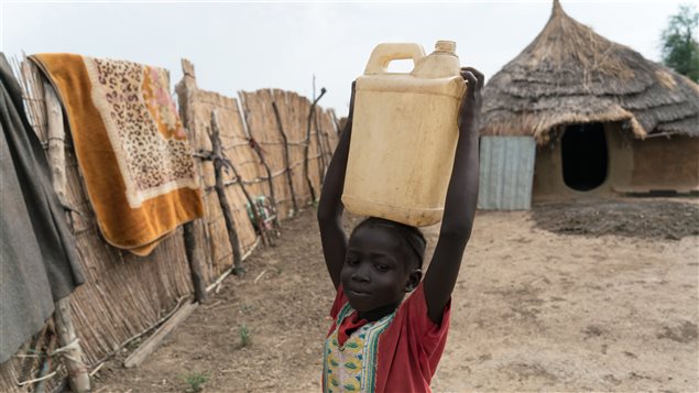  One of five-year-old Nyaching’s main responsibilities is to collect water for cooking, cleaning and drinking for the family. 