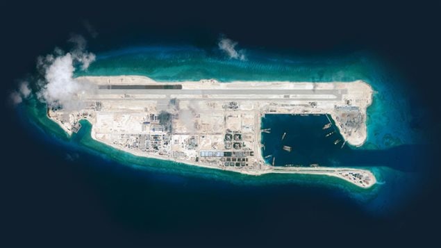 ..to full blown large island with military base with sheltered port, long airstrip and vast infrastructure by Sept. 2015