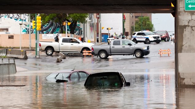 With sudden massive downpours, the water so quickly overwhelmed sewers that even as cars tried to go through an underpass, they were caught and flooded.