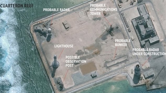 A satellite image shows militarization of the artificial islands. Photo shows construction of possible radar tower facilities at an artificial island near the Cuarteron Reef in the South China Sea