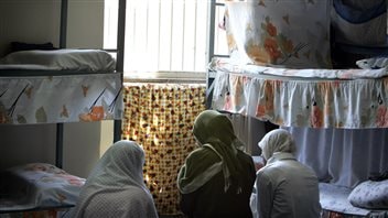  Iranian women prisoners sit at their cell in Tehran’s Evin prison June 13, 2006.
