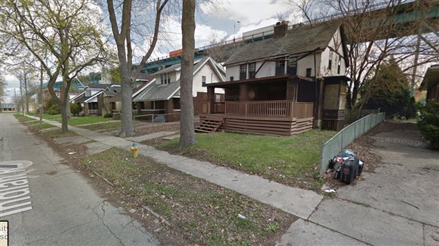 Some of the 100 or so formerly lovely homes In Windsor Ontario now owned and left abandoned to rot by American billionaire Manuel Maroun who owns the Windsor-Detroit *Ambassodor Bridge* seen in the background