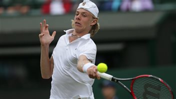 Denis Shapovalov (shown winning the boys' singles at Wimbledon) will try to power his way past the first round of the Rogers Cup after gaining a wild-card entry into the main draw. He's tall and blond, wearing a white baseball cap backwards and preparing to smash a lefty forehand.
