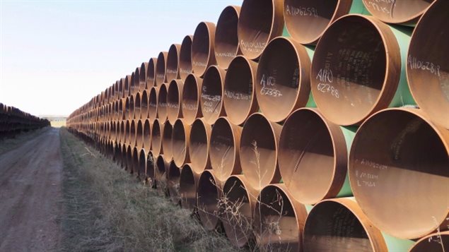 The $15.7-billion Energy East pipeline would carry 1.1 million barrels a day of western crude as far east as Saint John, N.B. We see a hundreds of brown barrels stacked four-high in a long row.