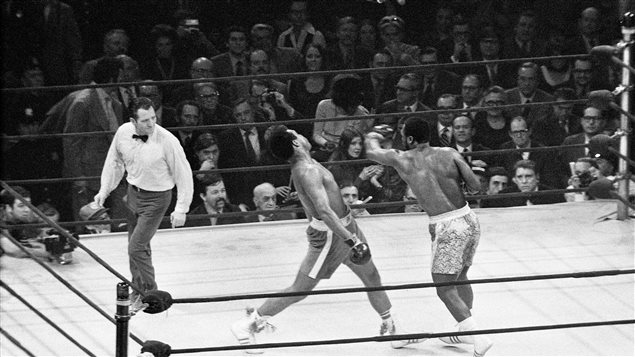Joe Frazier, right, lands a left hook on Muhammad Ali during the so-called "Fight of the Century" at New York's Madison Square Garden on March 8, 1971. Ali's gloves and Frazier's jock strap are now up for grabs. It's a black-and-white photo from well back-a classic boxing shot.