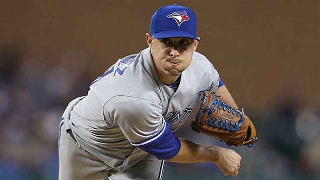 Aaron Sanchez, arguable Toronto's best pitcher, appears headed to the Toronto bullpen following Monday's trade deadline. We see Sanchez finishing off a pitch in his grey and blue Toronto away uniform.
