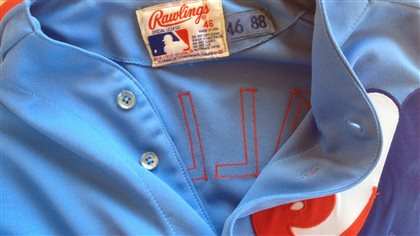 The great majority of professional athletes tend to have big hearts under their uniforms. We see the top of an old Expos jersey with the top buttons open.